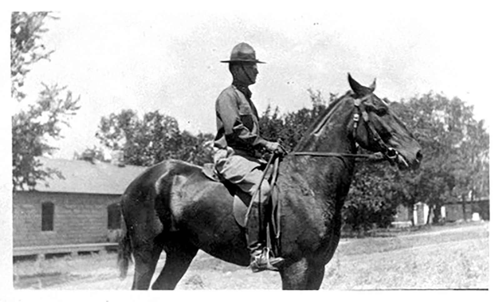 Black and white photo of Harry Truman mounted on an Army Calvary Horse