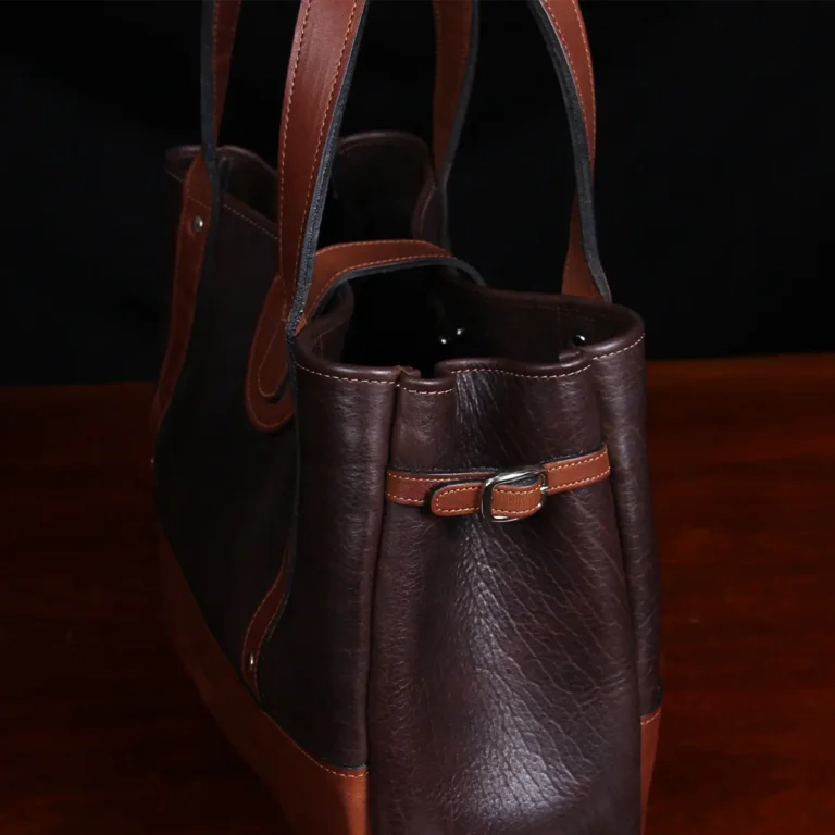 Bentley Tote in dark Tobacco Brown American Buffalo with contrasting vintage brown American Steerhide Trim - detail side view showing side buckle