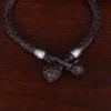braided brown leather bracelet showing the pewter beads