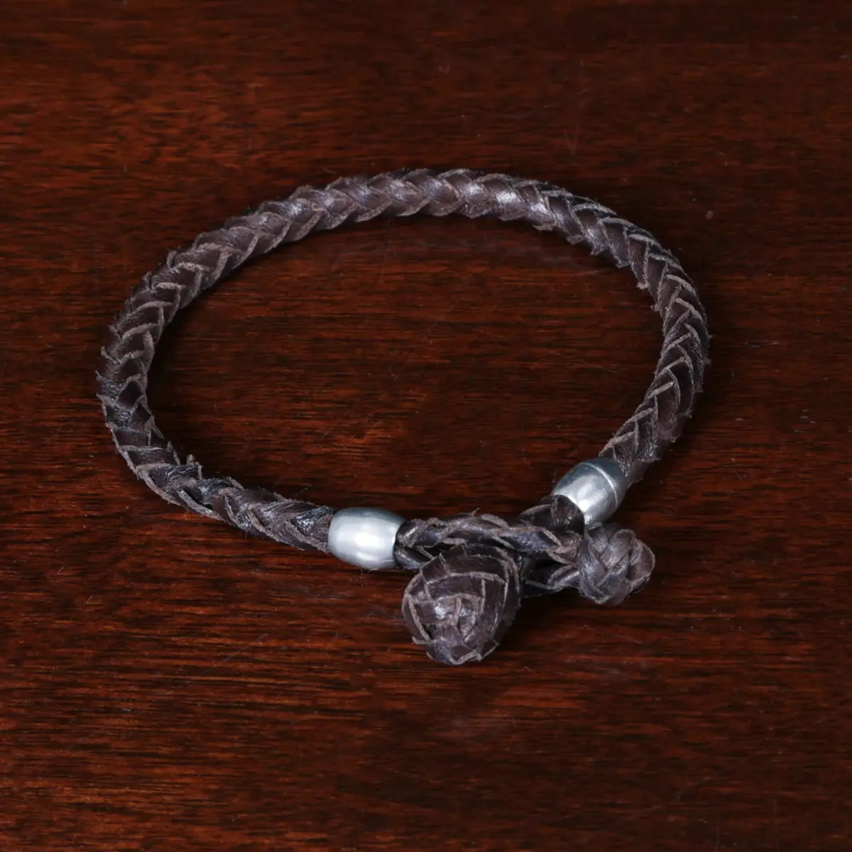braided brown leather bracelet with pewter beads and loop closure