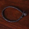 braided brown leather bracelet with and loop closure - top view