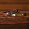 cutout of the camp bracelet showing an engraved name on the brass tag