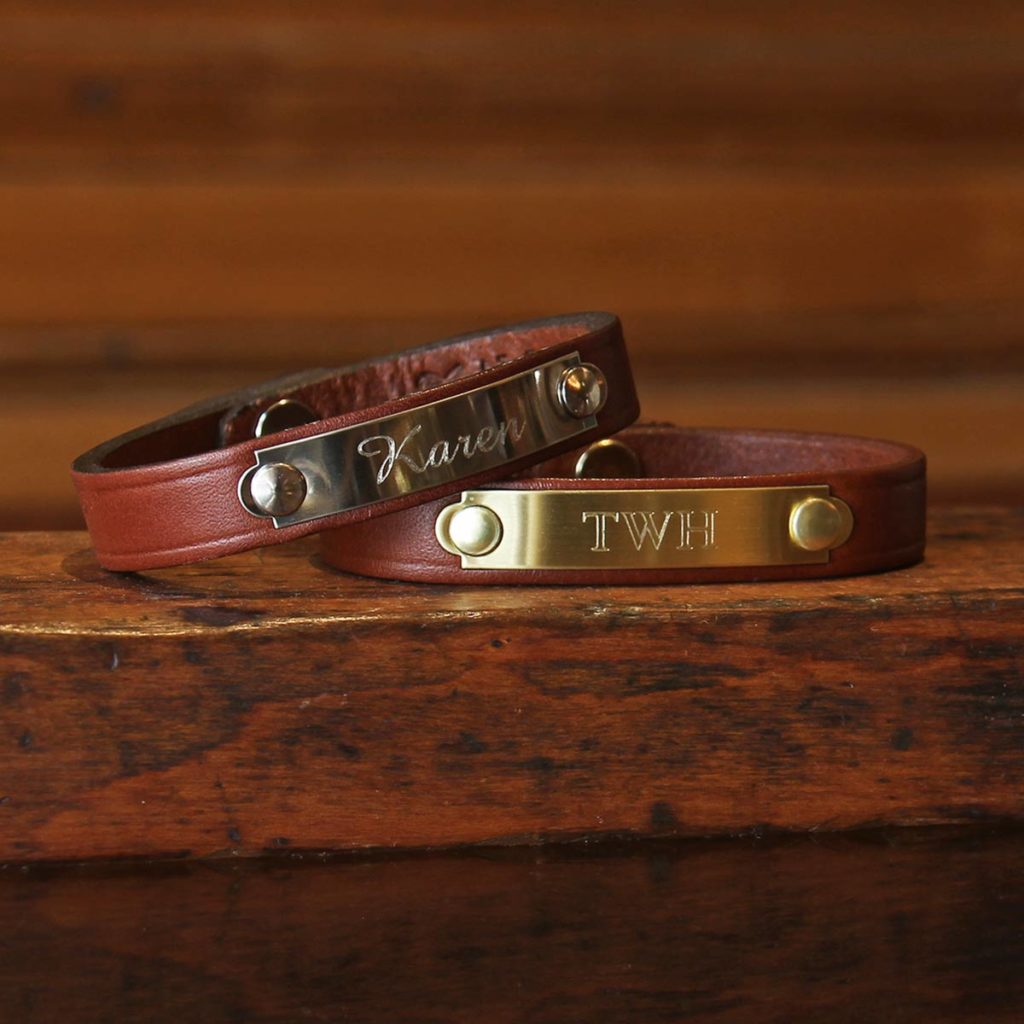 cutout of the camp bracelet showing an engraved name on the brass tag