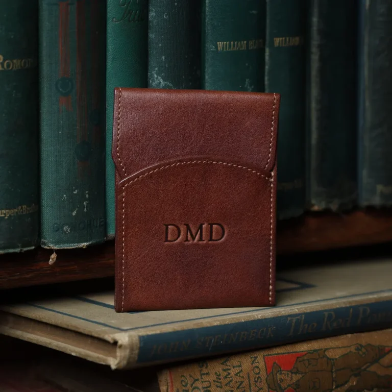 brown leather front pocket wallet with flap on with books