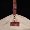no7 khaki cotton canvas garment bag with brown leather strap - hanging up