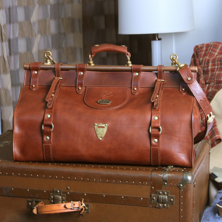 leather travel grip bag on trunk