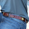 man wearing no1 brown leather belt with brass hardware