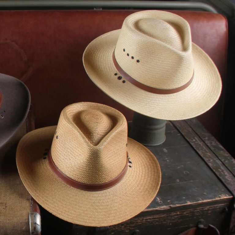 both versions of the panama hats on an old vintage trunk