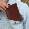no 23 pocket journal in a mans pocket in the front of his shirt