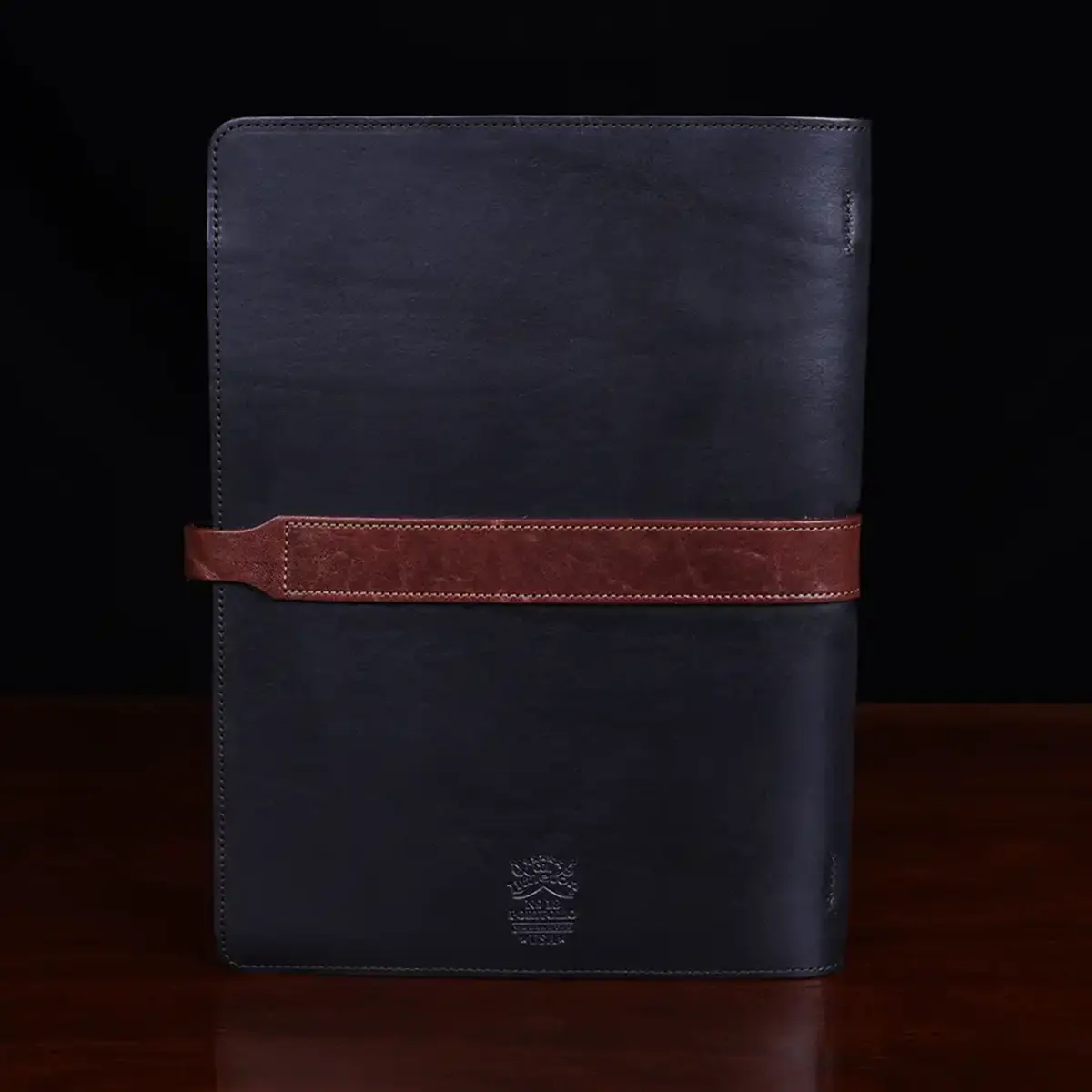 no 18 portfolio in vintage brown and black sitting on a table