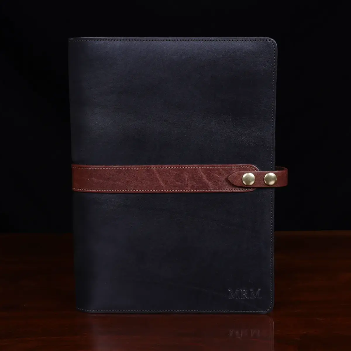 no 18 portfolio in vintage brown and black sitting on a table