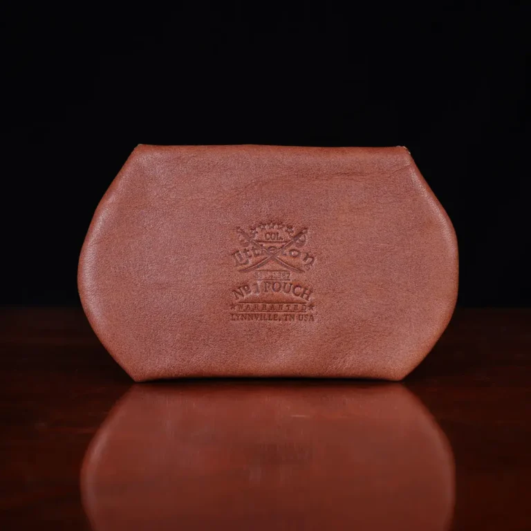 no1 leather vintage brown pouch with personalization on a wooden table with a dark background - back view