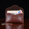 no 15 pouch in vintage brown showing the front with content inside