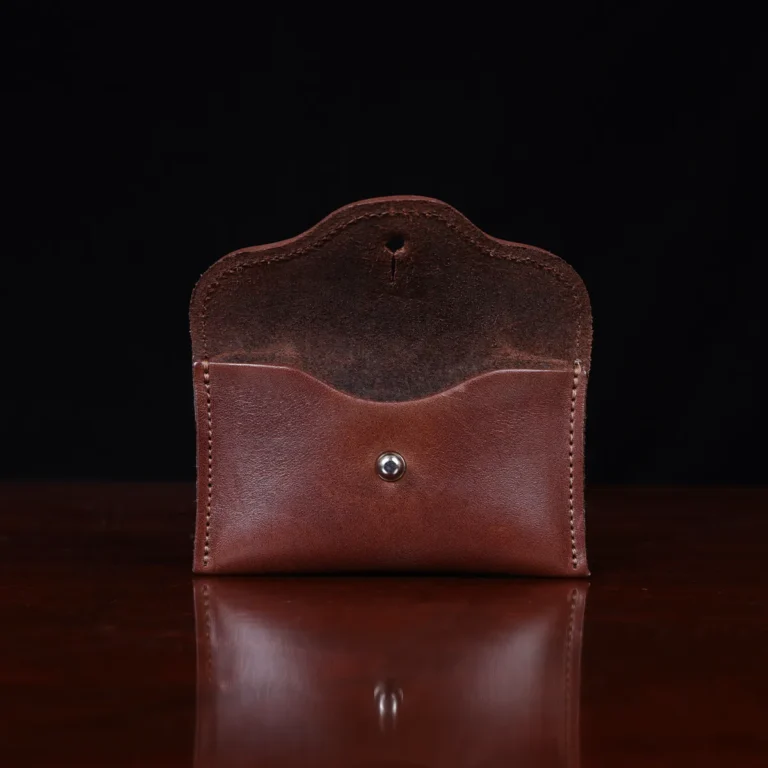 no15 vintage brown american leather pouch on a wooden table with a dark background - open view