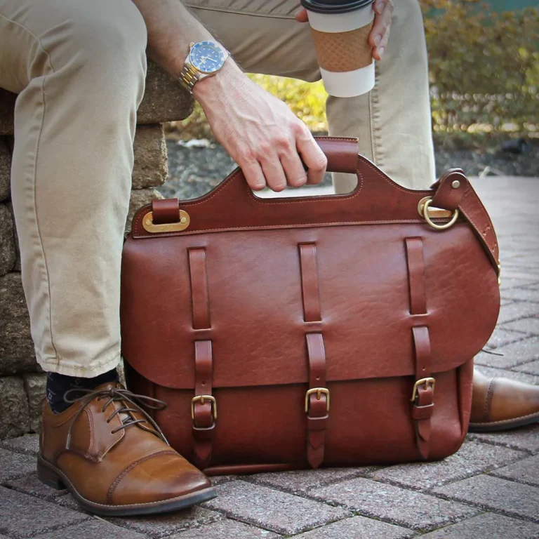 NO. 1 SADDLEBAG BRIEFCASE being held by a man on a bench