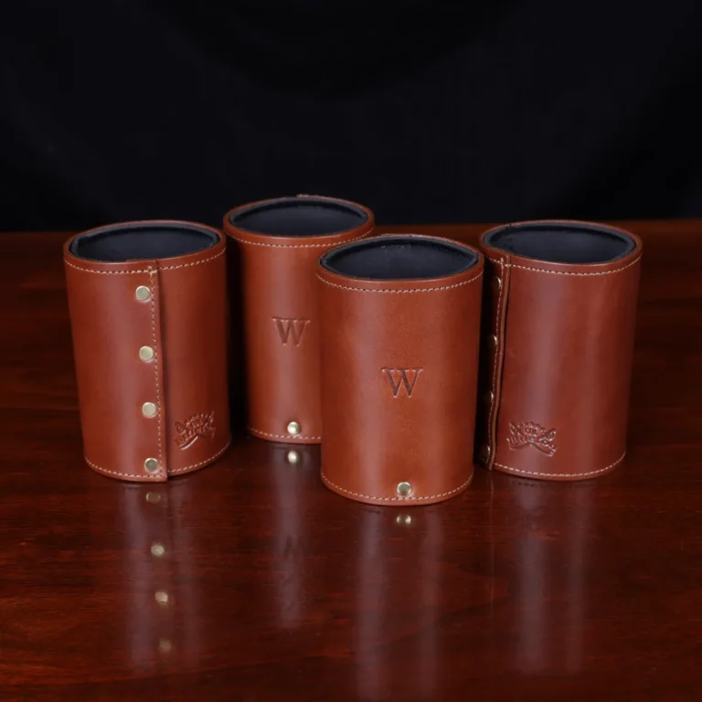 four of the can caddies showing the embossed stamp and the backside