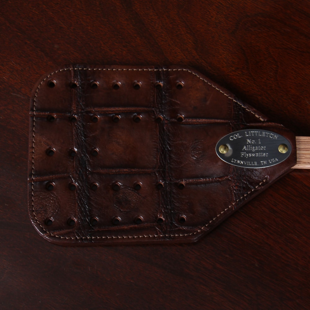 No. 1 Flyswatter in brown American Alligator with a wooden handle - detail view of the front of the paddle
