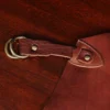 leather apron - on wooden table - view of hook