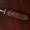 no2 shoehorn with personalization plate on a wooden table - view of handle