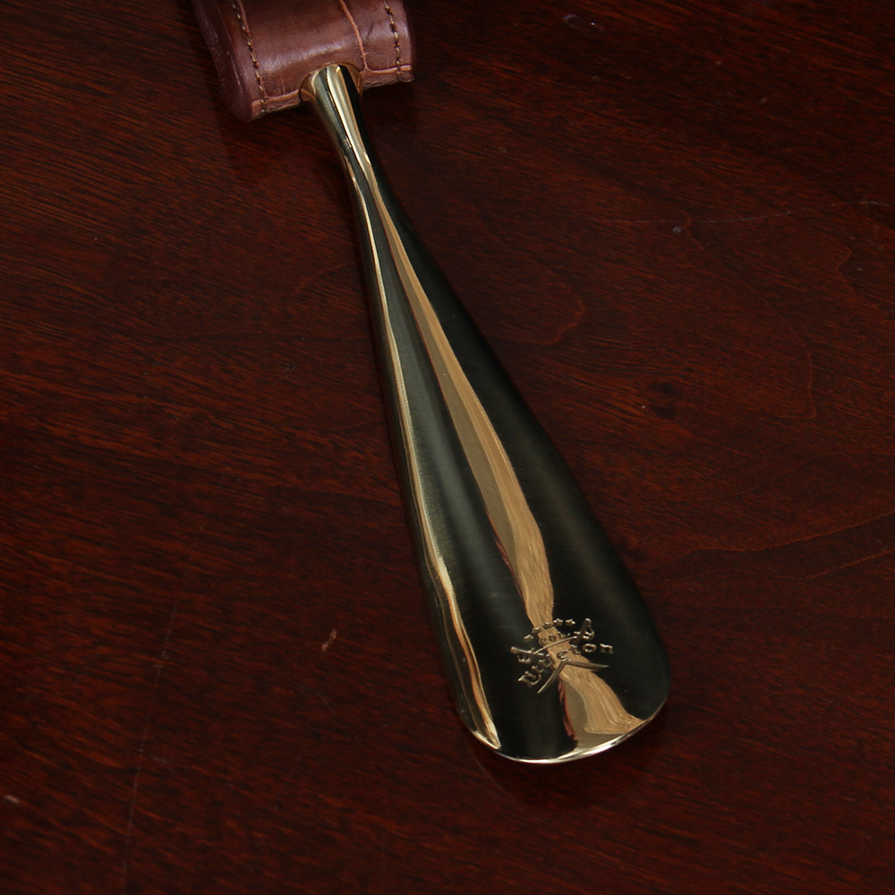 No. 2 Shoehorn in brown American Alligator with brass hardware - detail view of etched logo
