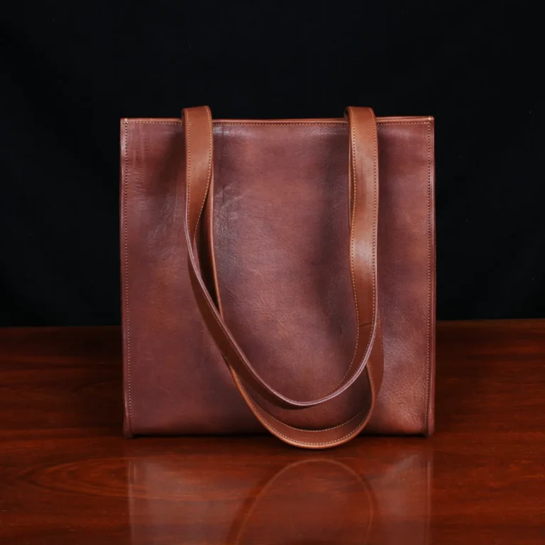 No. 9B Leather Tote in Vintage Brown - back view - on wood table with dark background