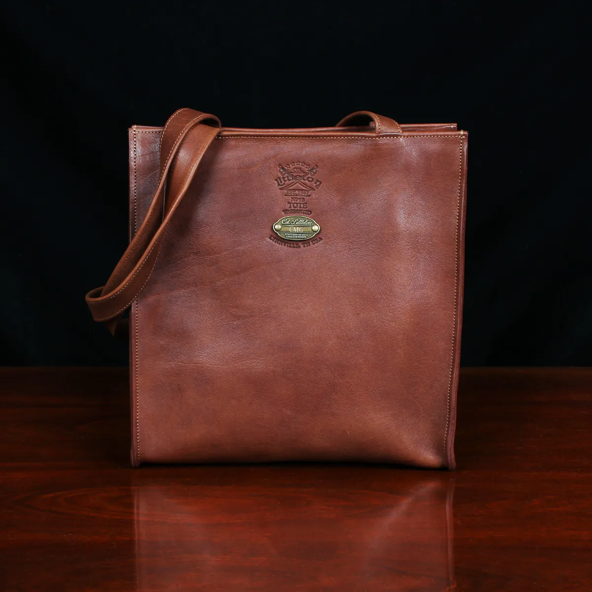 No. 9B Leather Tote in Vintage Brown - front view - on wood table with dark background