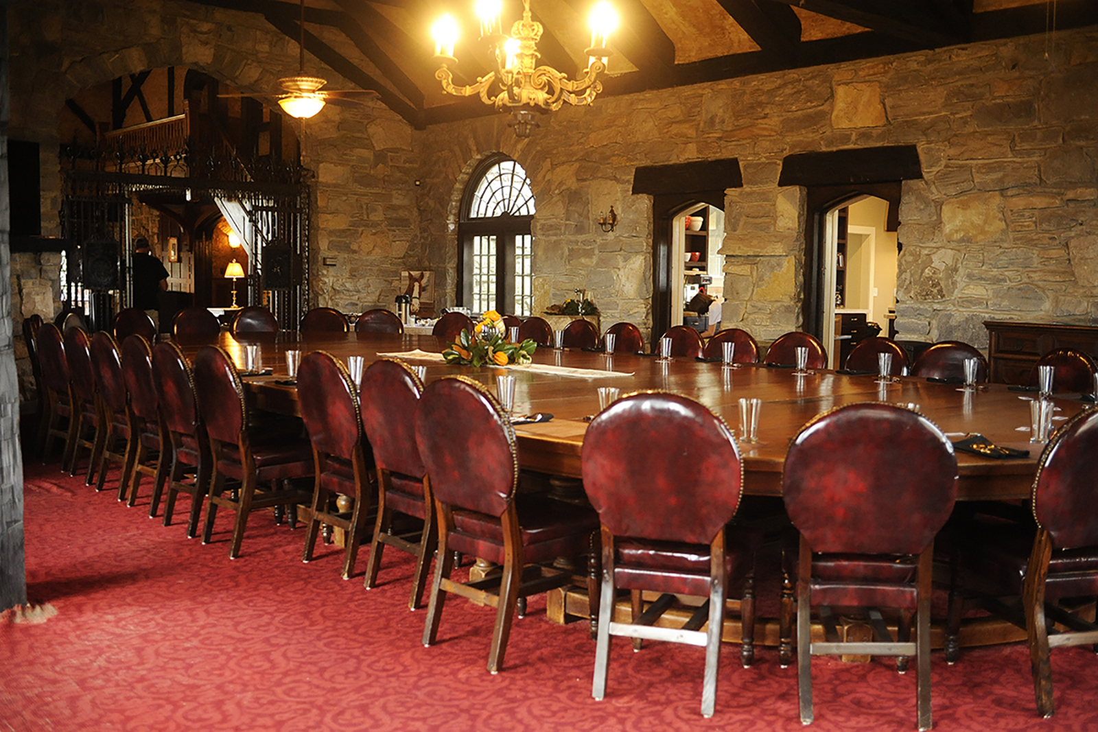 40-person table in the massive dining room inside the manor house of the Milky Way Farm.