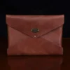 emissary envelope in vintage brown showing the front