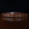 An American Alligator Belt with Nickel hardware showing the back view on a wooden table with black background - id 001