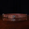 No. 4 Belt in American Alligator - X-Large - ID 001 - side view on a wooden table with black background