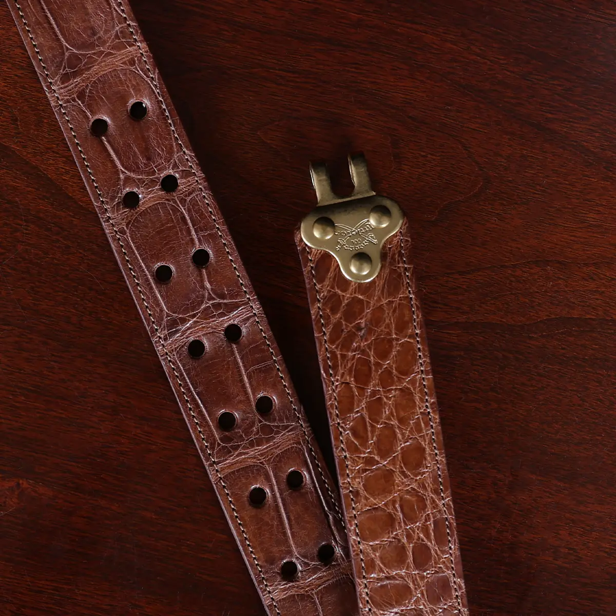 No. 5 Cinch Belt in brown American Alligator and brass buckle - ID 001 - unhooked view on black background