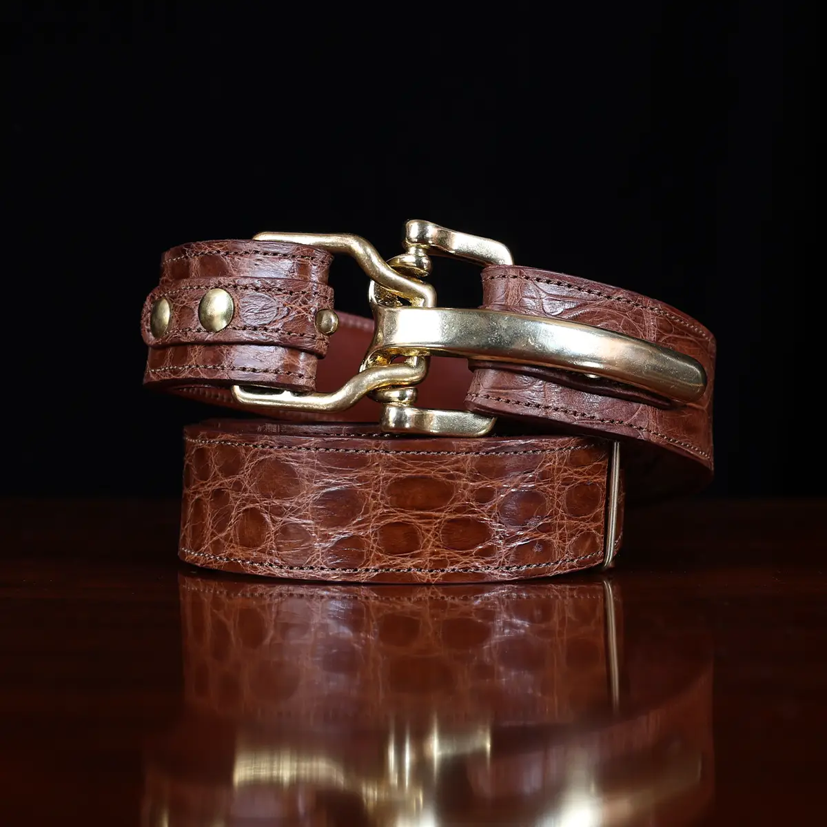No. 5 Cinch Belt in brown American Alligator and brass buckle - ID 001 - front coiled view on black background