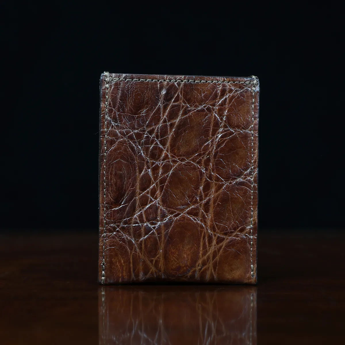 View larger image of No. 4 Card Case in Vintage Brown American Alligator - ID 001 - front view cut out on No. 2 Card Wallet in Vintage Brown American Alligator - ID 001 - back view on a black background