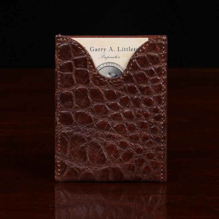 No. 4 Card Case in Vintage Brown American Alligator - ID 001 - front view cut out on No. 2 Card Wallet in Vintage Brown American Alligator - ID 001 - front view with card on a black background