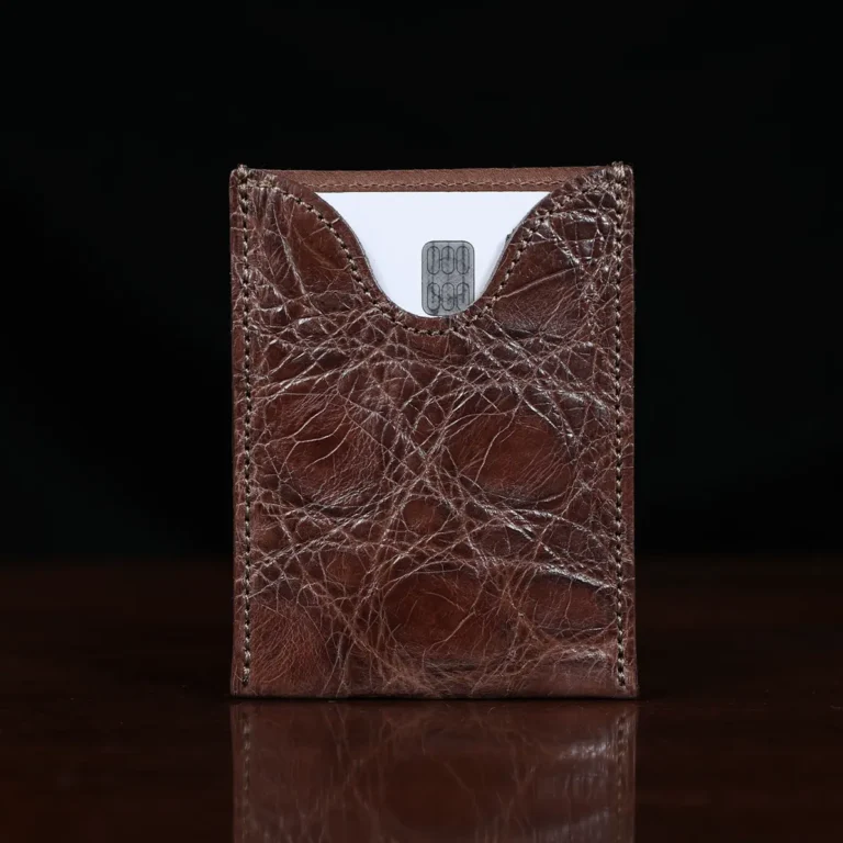 No. 4 Card Case in Vintage Brown American Alligator - ID 001 - front view cut out on No. 2 Card Wallet in Vintage Brown American Alligator - ID 001 - front view with card on a black background