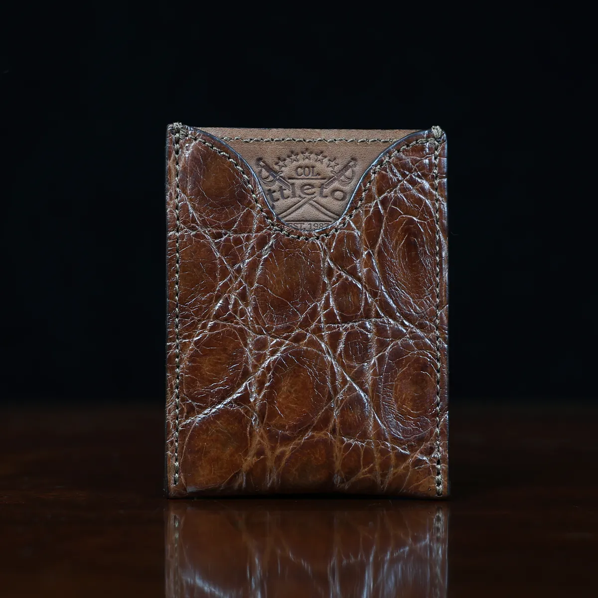 View larger image of No. 4 Card Case in Vintage Brown American Alligator - ID 001 - front view cut out on No. 2 Card Wallet in Vintage Brown American Alligator - ID 001 - front view on a black background