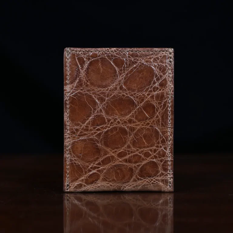 No. 4 Card Case in Vintage Brown American Alligator - ID 002 - back view on a wood table and dark background