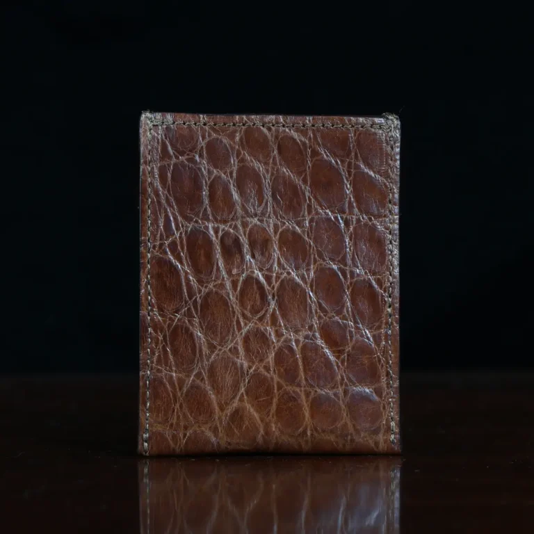 No. 4 Card Case in Vintage Brown American Alligator - ID 002 - back view on a wood table and dark background