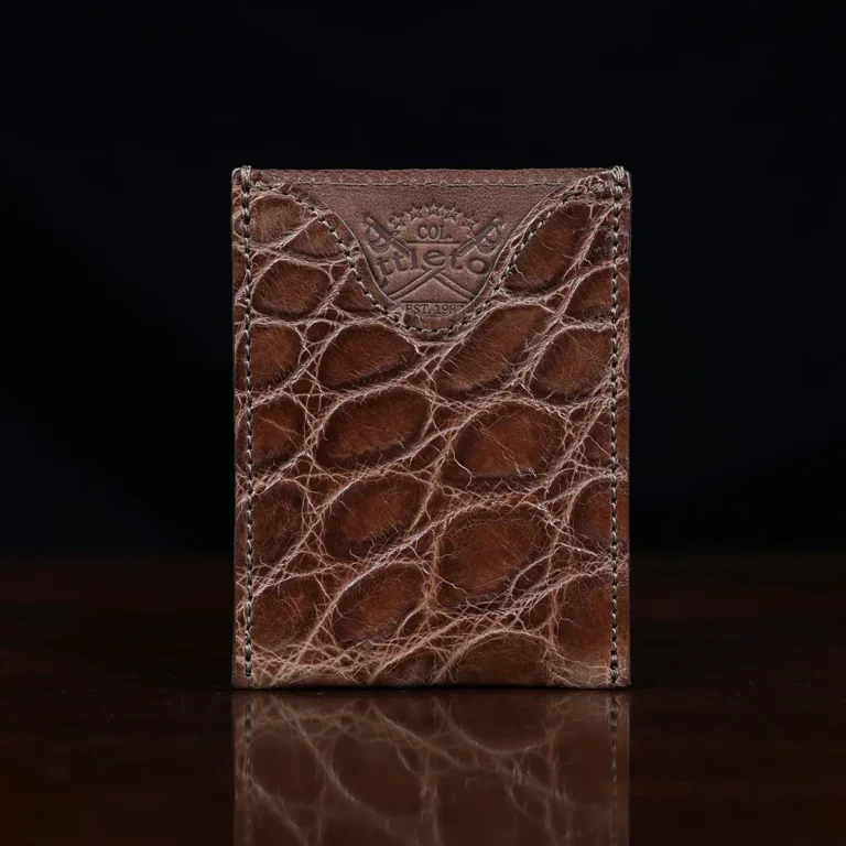 No. 4 Card Case in Vintage Brown American Alligator - ID 002 - front view on a wood table and dark background