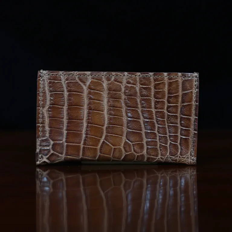 No. 3 Card Wallet in Vintage Brown American Alligator - ID 003 - front view with business card cut out on No. 2 Card Wallet in Vintage Brown American Alligator - ID 001 - back view on a black background