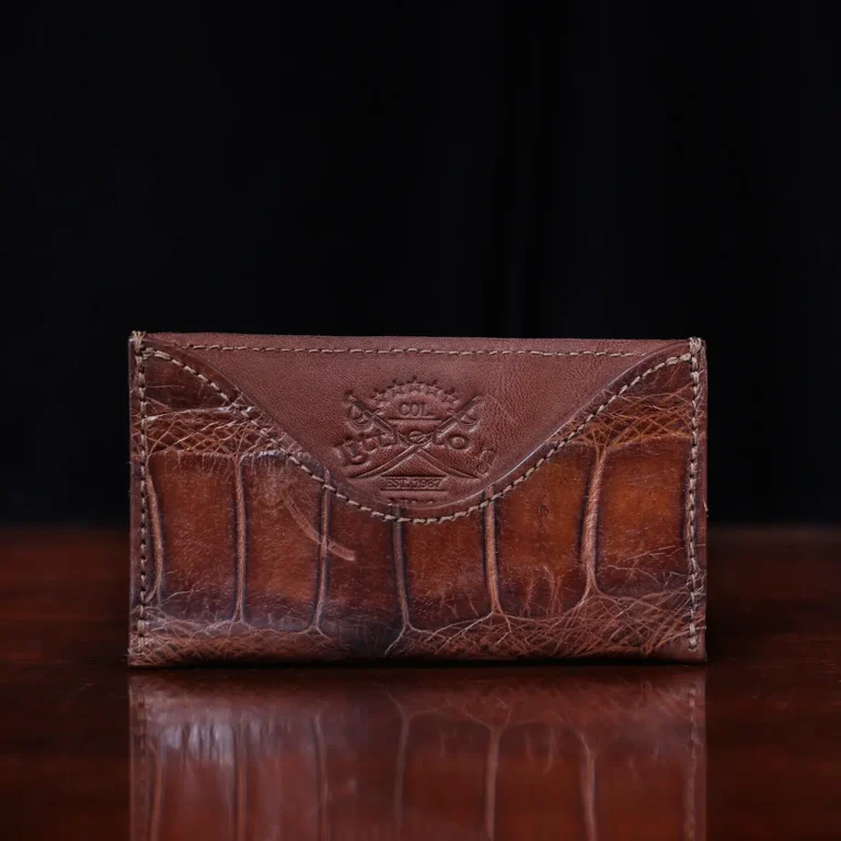 No. 3 Card Wallet in Vintage Brown American Alligator - ID 003 - front view with business card cut out on No. 2 Card Wallet in Vintage Brown American Alligator - ID 001 - front view on a black background