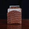 Front pocket wallet in brown American Alligator - ID 001 - front view with money on black background