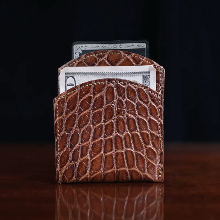 Front pocket wallet in brown American Alligator - ID 001 - front view with money on black background
