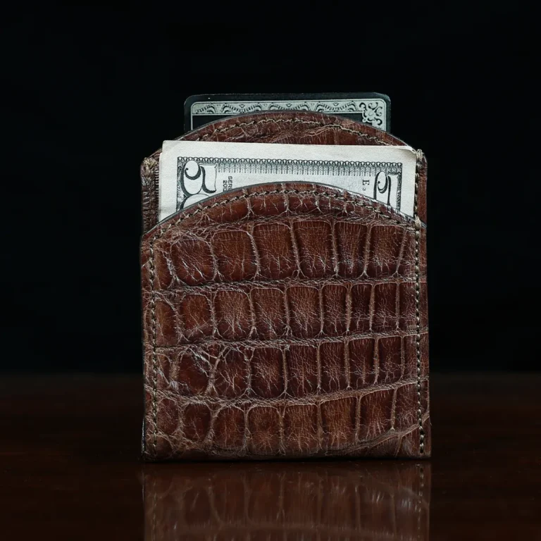 Front pocket wallet in brown American Alligator - ID 001 - front view with money on black background