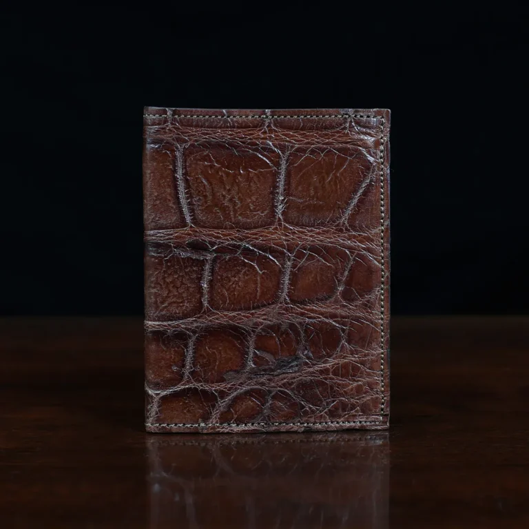 No. 2 card wallet in Vintage Brown American Alligator - ID 001 - front view on a wood table and dark background
