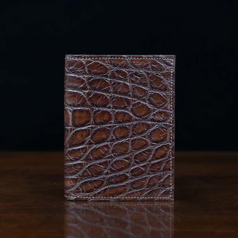 No. 2 card wallet in Vintage Brown American Alligator - ID 001 - front view on a wood table and dark background