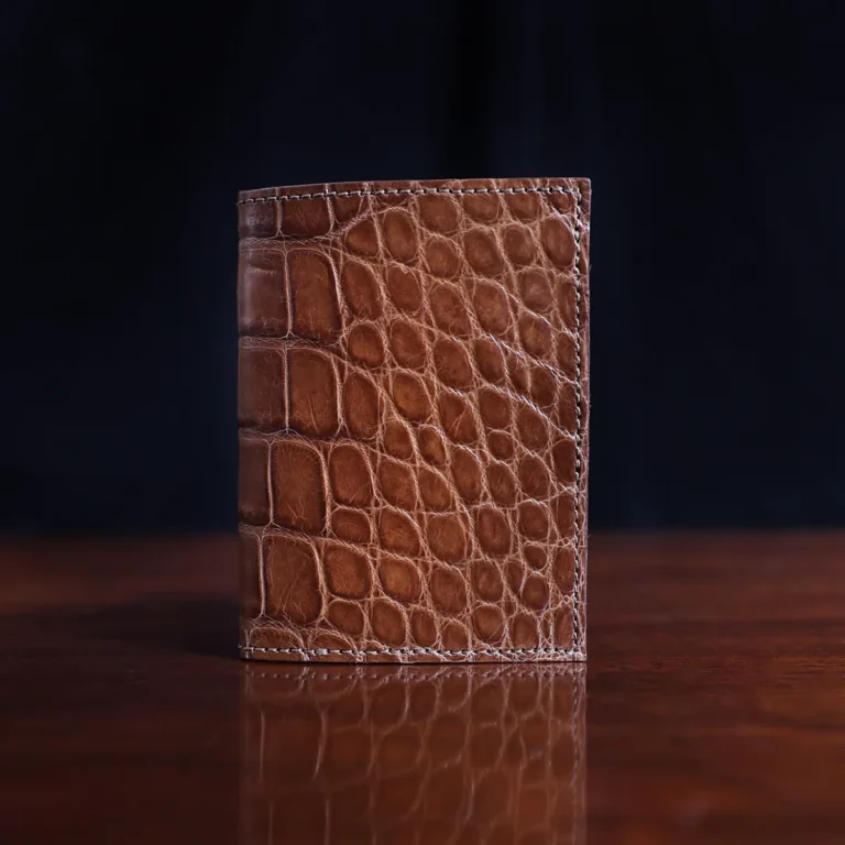 No. 4 Card Case in Vintage Brown American Alligator - ID 001 - front view on a wood table and dark background