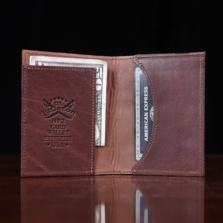 No. 4 Card Case in Vintage Brown American Alligator - ID 001 - open with money view on a wood table and dark background