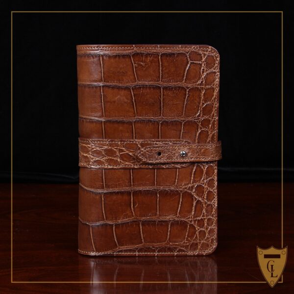 No. 20 Portfolio in Vintage Brown American Alligator - ID 001 - front view cut out on No. 2 Card Wallet in Vintage Brown American Alligator - ID 001 - front view on a black background