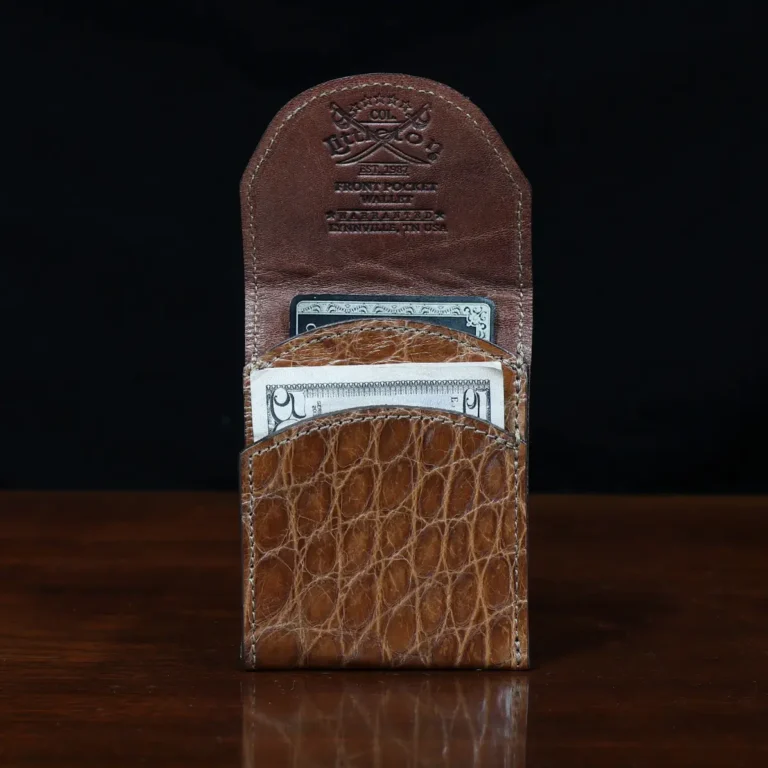 front pocket wallet in american alligator showing the front open with cash and card